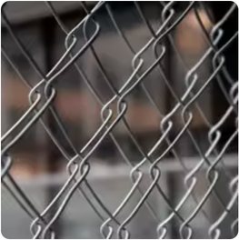 Close view of an erected galvanized chain link fence