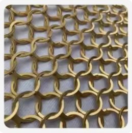 Close view of brass-toned chain mail ring mesh