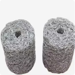 Two compressed rolls of stainless steel knitted wire mesh